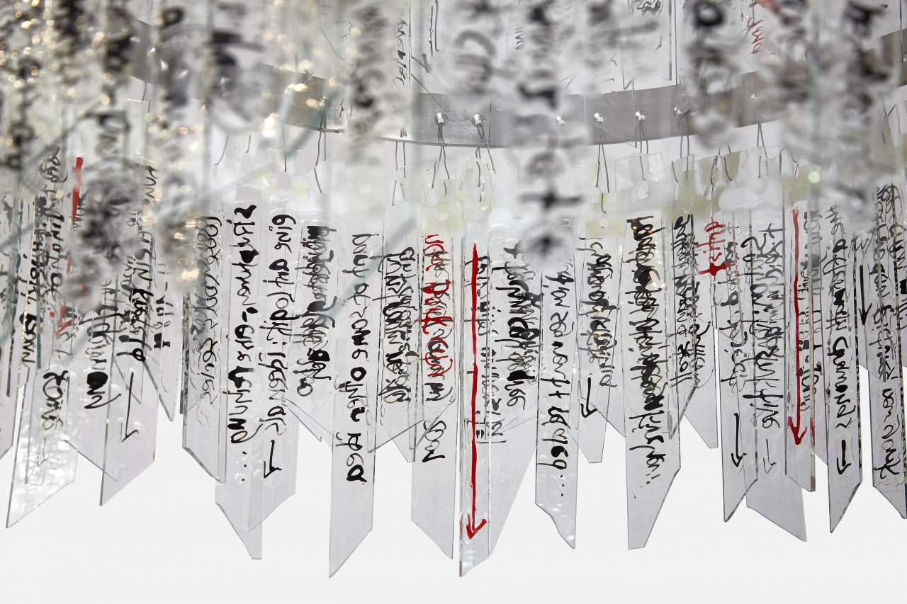 Detail: Chandelier 2019 Text: Exhibitions + Locations Stainless Steel, Ink/Glue on Glass, Diameter 52 cm x 64cm