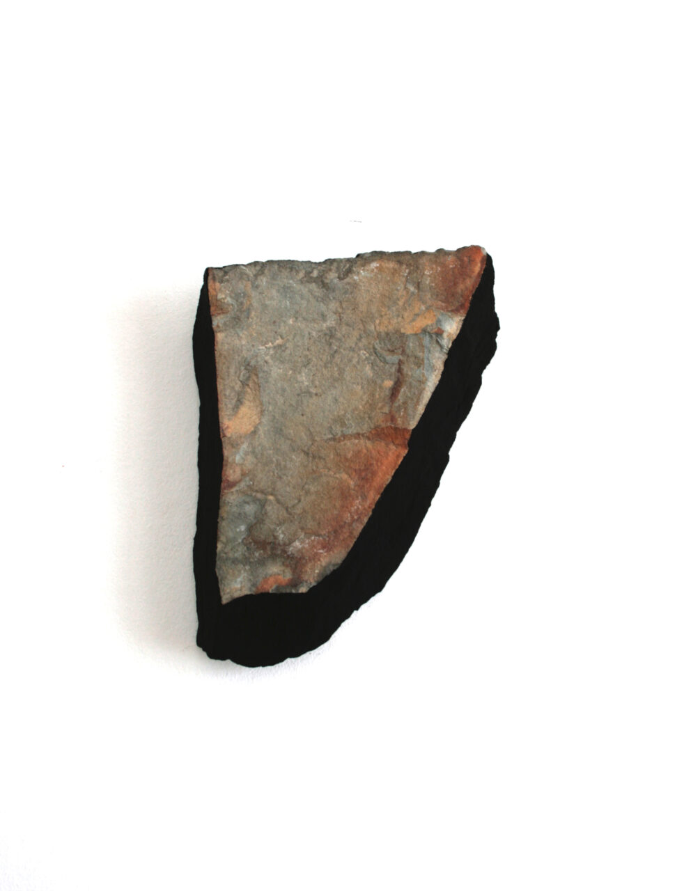 MORNING IN THE BOWL OF NIGHT ( V ) after Rubáiyát of Omar Khayyám, 2022, Cumbrian stone fragment, iron oxide and ultra-black resin 16.0 x 12.0 x 2.7cm